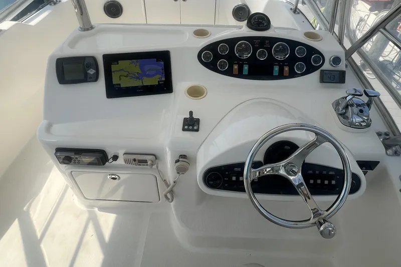 Slide: The Image of Helm of 2007 Riviera 33 Flybridge with navigation equipment and steering wheel. - 38