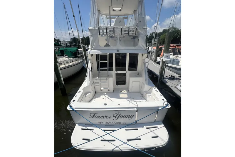 Slide: The Image of 2007 Riviera 33 Flybridge yacht docked, named "Forever Young," at Bethany Beach, DE. - 9