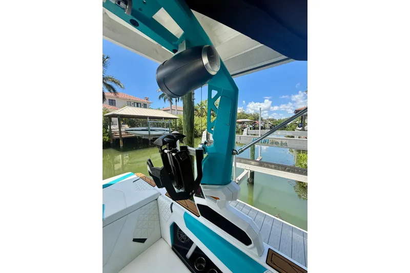 Slide: The Image of 2024 Nautique Super Air Nautique GS20 boat interior with teal accents and speaker system. - 11