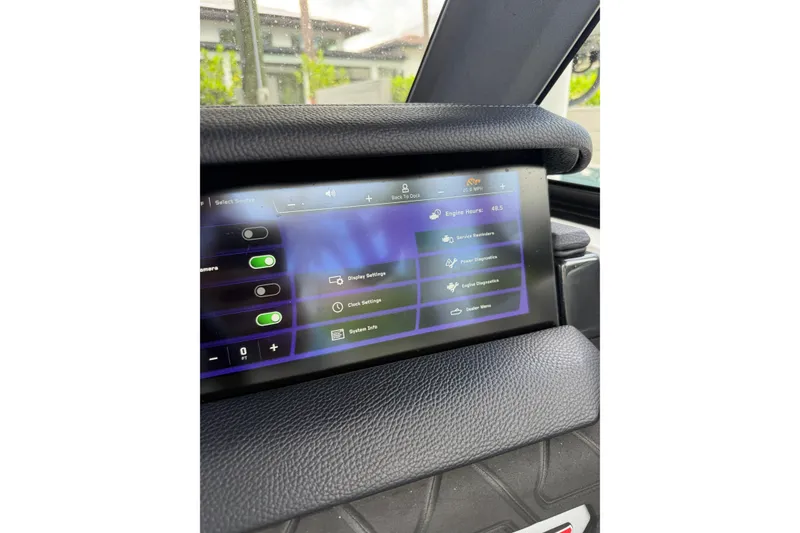 Slide: The Image of 2024 Nautique Super Air Nautique GS20 dashboard display with control settings and diagnostics. - 15