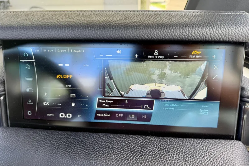 Slide: The Image of 2024 Nautique Super Air Nautique GS20 dashboard display showing wake settings and navigation controls. - 16