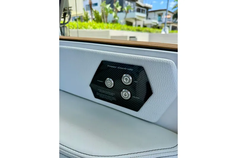 Slide: The Image of 2024 Nautique Super Air Nautique GS20 tower controls on white interior panel. - 25