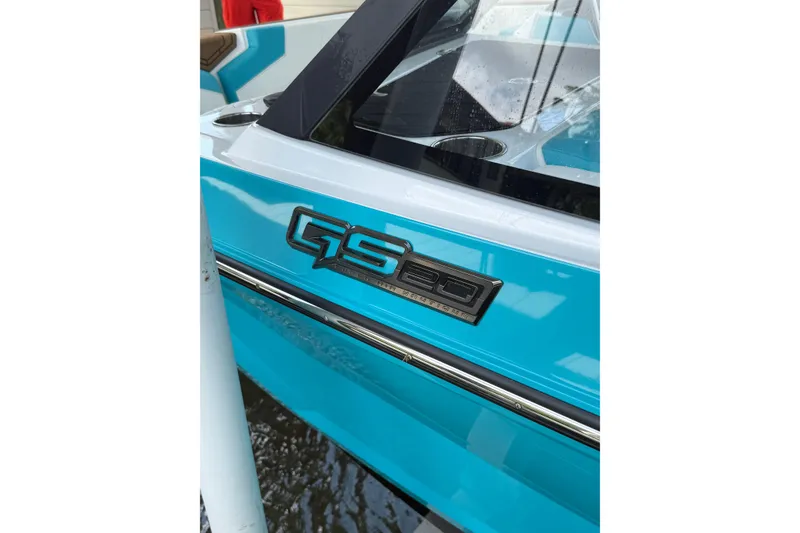 Slide: The Image of 2024 Nautique Super Air Nautique GS20 boat, blue exterior with GS20 emblem. - 28