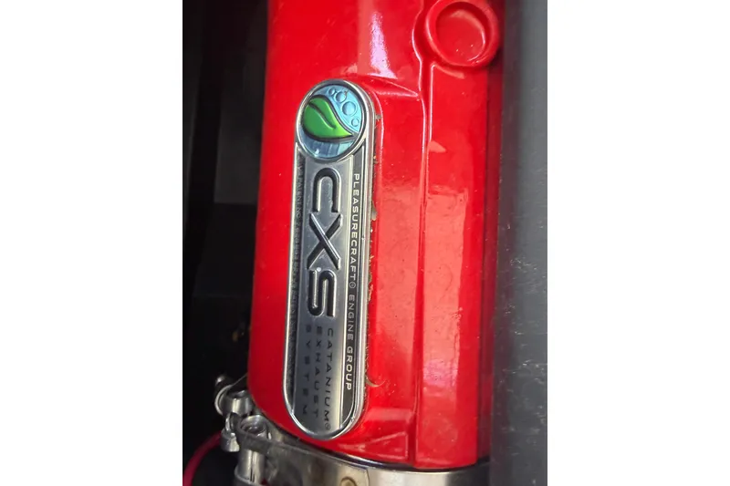 Slide: The Image of Red engine component of 2024 Nautique Super Air Nautique GS20 with CXS branding. - 29