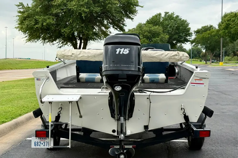 Slide: The Image of 2011 Lowe Fishing Machine 175 boat with 115 horsepower motor on a trailer. - 7