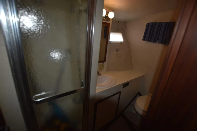 Slide: The Image of Bathroom interior of 1983 Hatteras 50 Convertible yacht with shower and sink. - 21