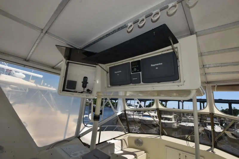 Slide: The Image of Interior view of 1983 Hatteras 50 Convertible yacht with Raymarine navigation equipment. - 8