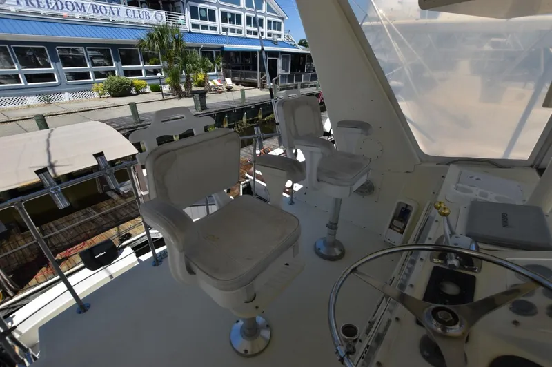 Slide: The Image of Cockpit view of 1983 Hatteras 50 Convertible yacht at dockside. - 9