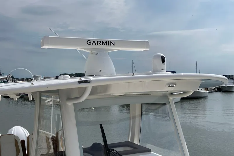 Slide: The Image of 2027 Regulator 35 boat with Garmin radar system, docked at a marina. - 5