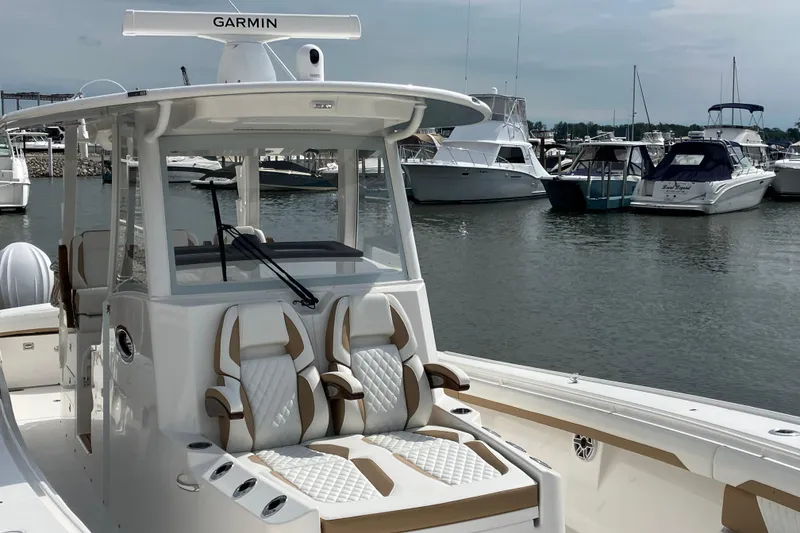 Slide: The Image of 2027 Regulator 35 boat with Garmin equipment docked in a marina. - 4