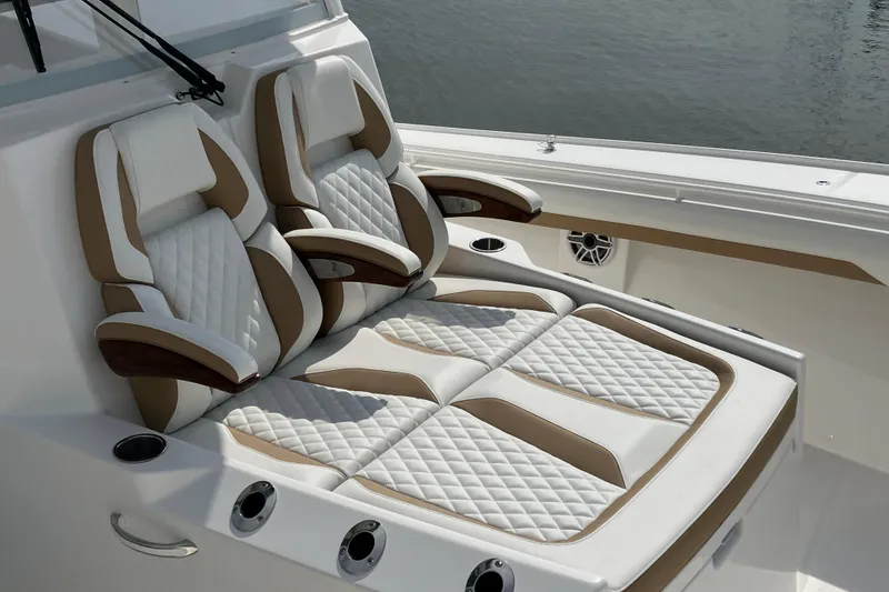Slide: The Image of Luxurious seating on 2027 Regulator 35 boat, featuring quilted upholstery and armrests. - 6