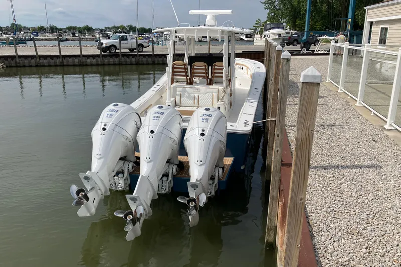 Slide: The Image of 2027 Regulator 35 boat docked with triple Yamaha 350 engines. - 13