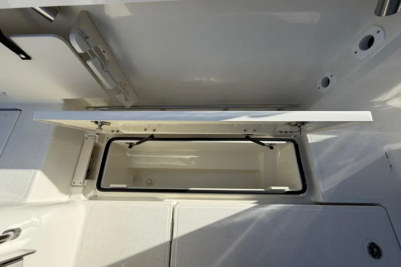 Slide: The Image of Open storage compartment on 2025 Bayliner Trophy T23 Pilothouse boat deck. - 44