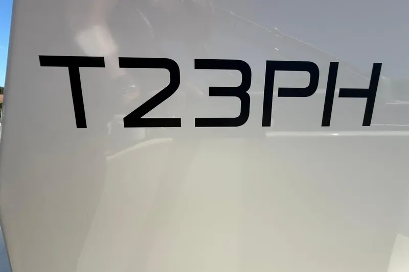 Slide: The Image of Close-up of 2025 Bayliner Trophy T23 Pilothouse model lettering on boat exterior. - 61