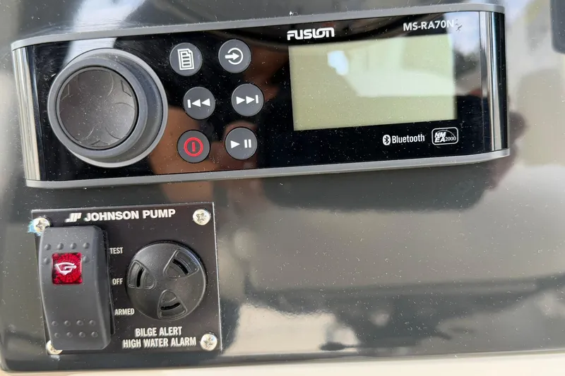 Slide: The Image of Control panel of 2025 Bayliner Trophy T23 Pilothouse with Fusion audio and Johnson Pump. - 27