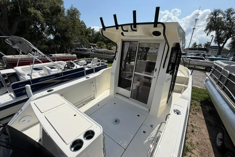 Slide: The Image of 2025 Bayliner Trophy T23 Pilothouse boat with spacious deck and modern design. - 12