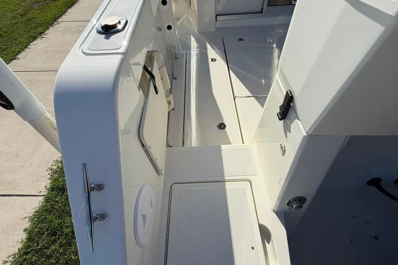 Slide: The Image of 2025 Bayliner Trophy T23 Pilothouse deck, showcasing sleek design and modern features. - 51