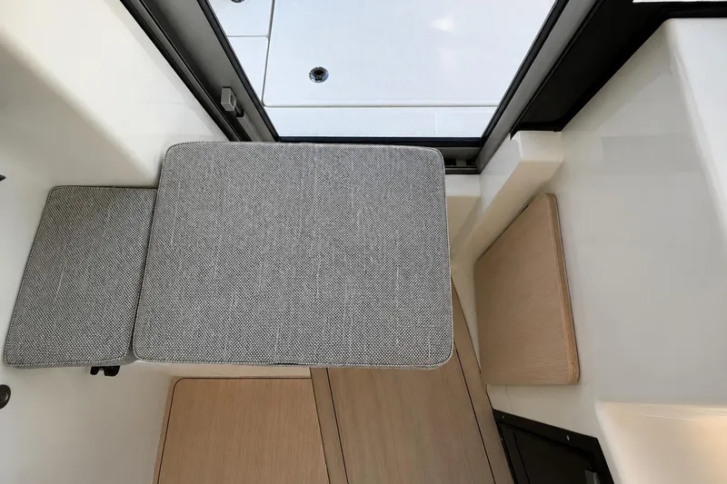 Slide: The Image of Interior seating of 2025 Bayliner Trophy T23 Pilothouse, featuring modern design and comfortable cushions. - 17