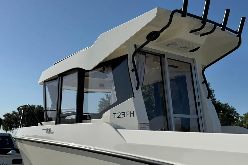 Slide: The Image of 2025 Bayliner Trophy T23 Pilothouse boat with sleek design and modern features. - 11