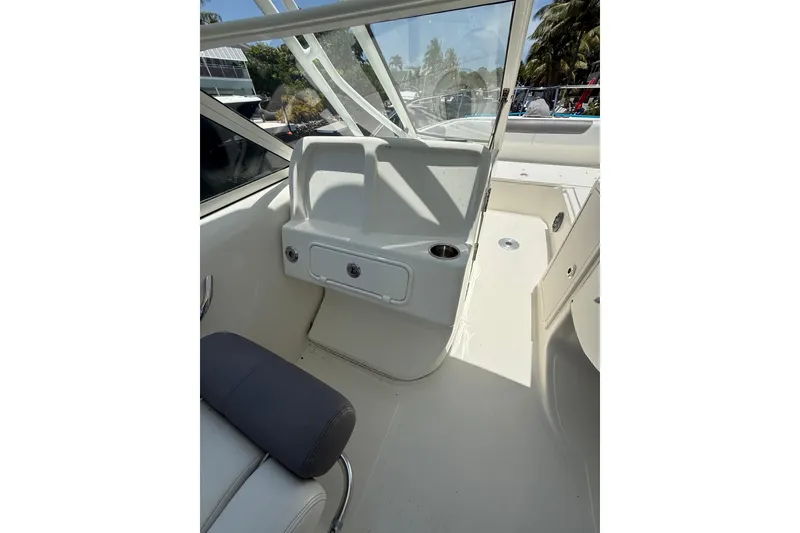Slide: The Image of 2018 World Cat 255 DC boat interior with seating and storage compartments. - 10