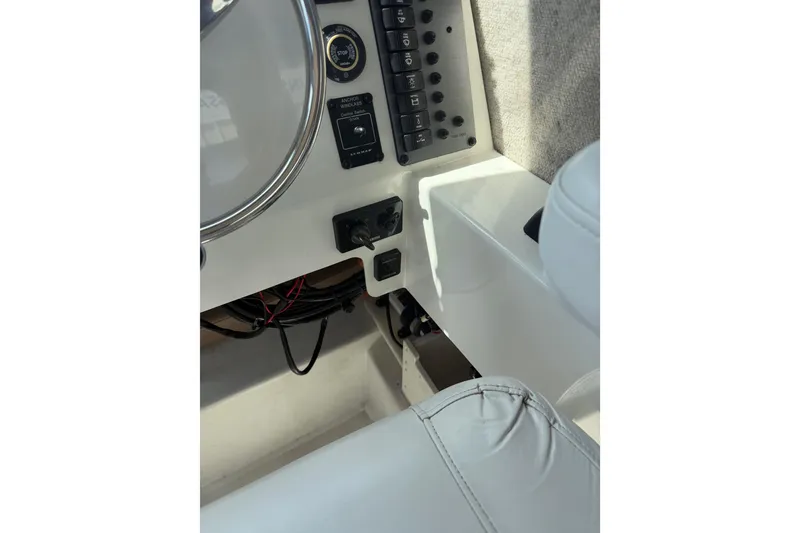 Slide: The Image of 2019 Parker 2320 SL Sport Cabin dashboard with controls and steering wheel. - 11