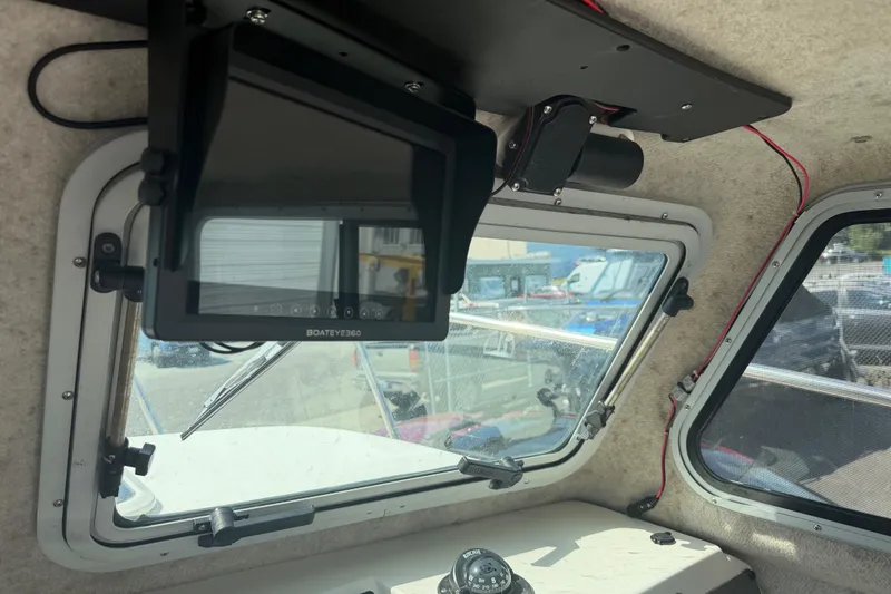 Slide: The Image of Interior of a 2019 Parker 2320 SL Sport Cabin with navigation equipment. - 12