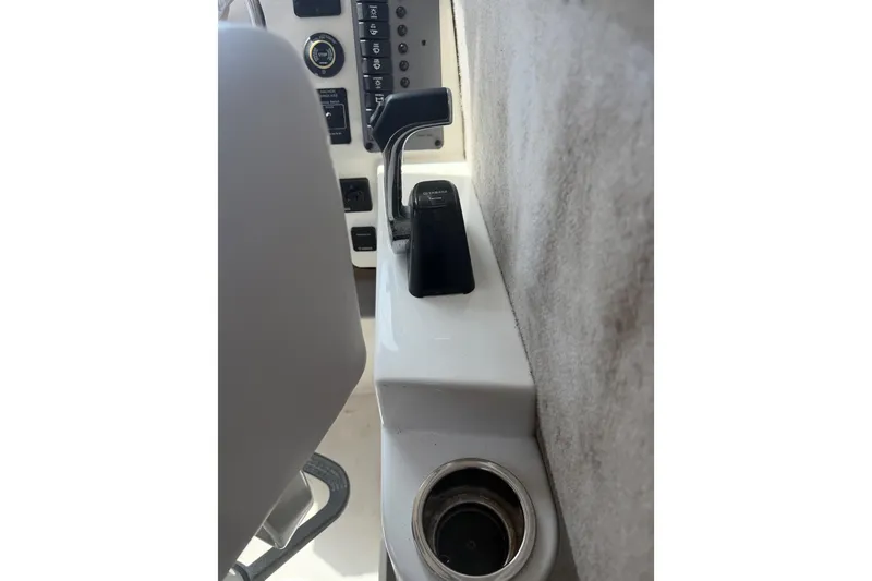 Slide: The Image of Throttle control and dashboard of a 2019 Parker 2320 SL Sport Cabin boat. - 14