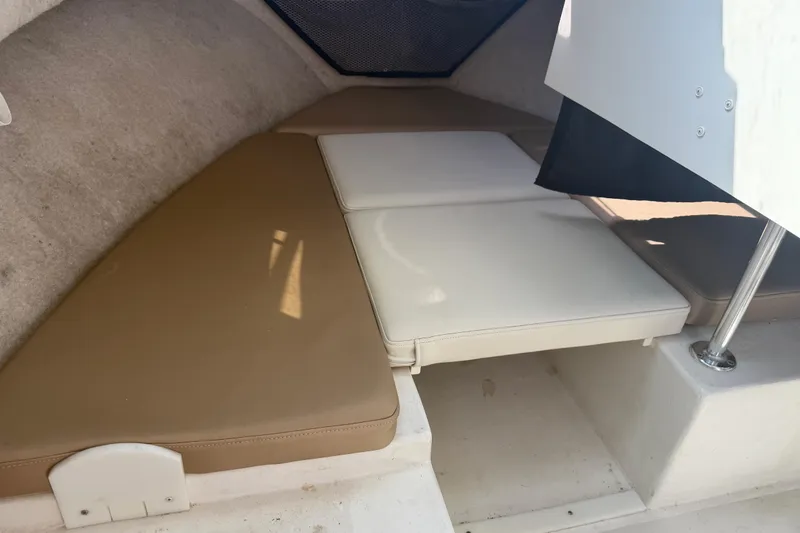 Slide: The Image of Interior cabin view of a 2019 Parker 2320 SL Sport Cabin boat with cushioned seating. - 17