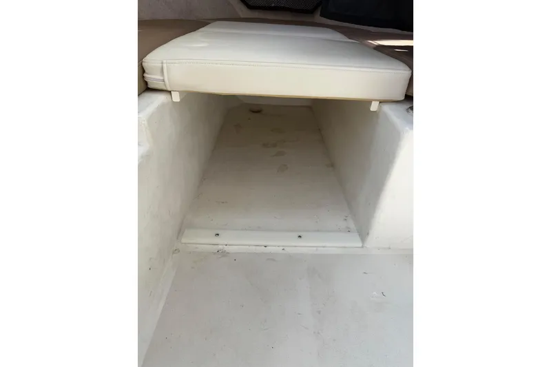 Slide: The Image of 2019 Parker 2320 SL Sport Cabin interior storage compartment with cushioned seating. - 18