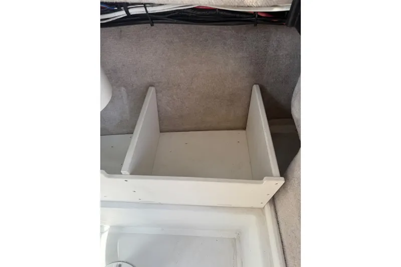 Slide: The Image of Interior storage compartment of 2019 Parker 2320 SL Sport Cabin boat. - 19