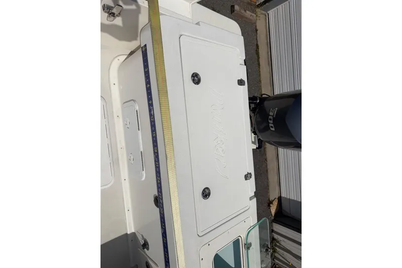 Slide: The Image of 2019 Parker 2320 SL Sport Cabin boat with outboard motor, viewed from above. - 25