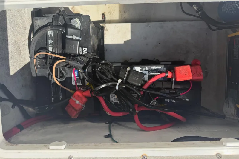 Slide: The Image of Battery compartment of a 2019 Parker 2320 SL Sport Cabin with cables and connectors. - 35