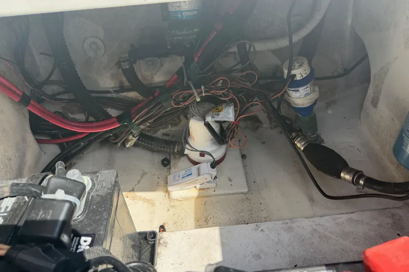 Slide: The Image of 2019 Parker 2320 SL Sport Cabin engine compartment with wiring and components. - 36