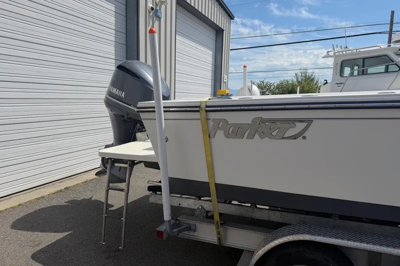 Slide: The Image of 2019 Parker 2320 SL Sport Cabin boat with Yamaha engine on trailer. - 4