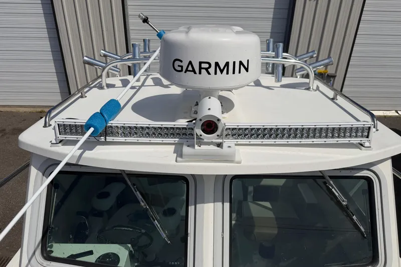 Slide: The Image of 2019 Parker 2320 SL Sport Cabin boat with Garmin radar and LED light bar. - 7