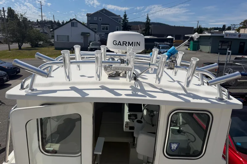 Slide: The Image of 2019 Parker 2320 SL Sport Cabin boat with Garmin equipment and multiple rod holders. - 8