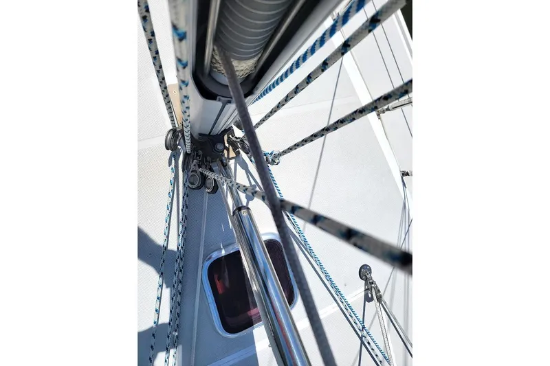 Slide: The Image of Close-up of Catalina 310 sailboat rigging, showcasing ropes and deck details, 2006 model. - 19