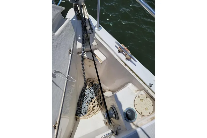 Slide: The Image of Anchor chain and rope storage on a 2006 Catalina 310 sailboat deck. - 21