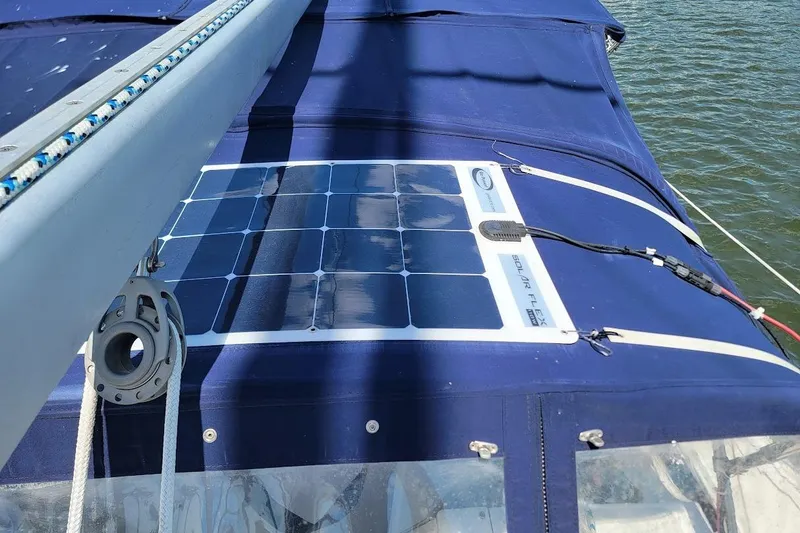 Slide: The Image of Solar panel on 2006 Catalina 310 sailboat, mounted on blue canvas cover. - 23