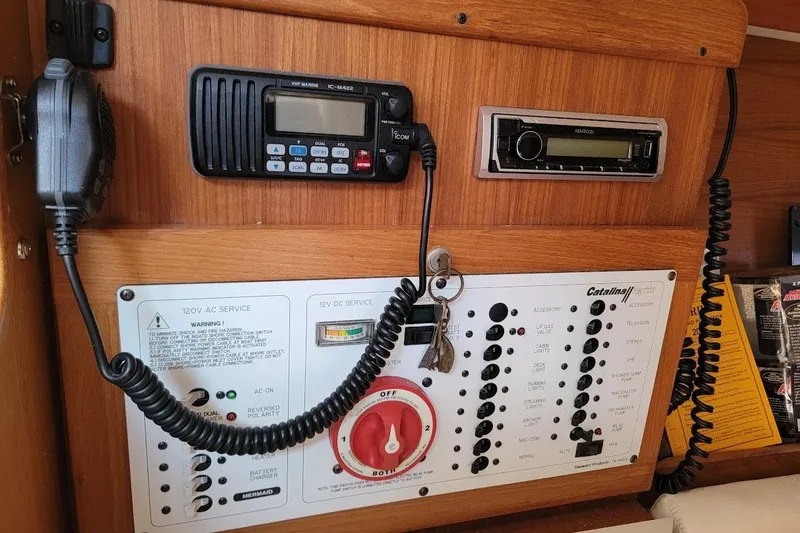 Slide: The Image of Control panel of a 2006 Catalina 310 sailboat with radio and electrical switches. - 8