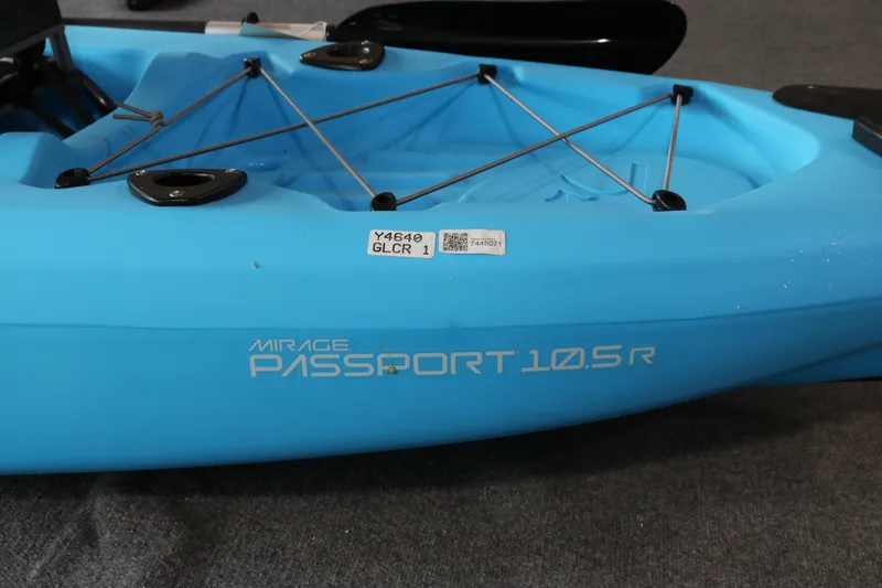 Slide: The Image of Blue 2024 Hobie Mirage Passport 10.5 R kayak with bungee storage and sleek design. - 6