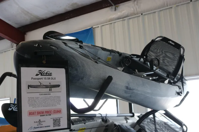 The Image of 2024 Hobie Mirage Passport 10.5 R kayak displayed with price tag in showroom. - 0