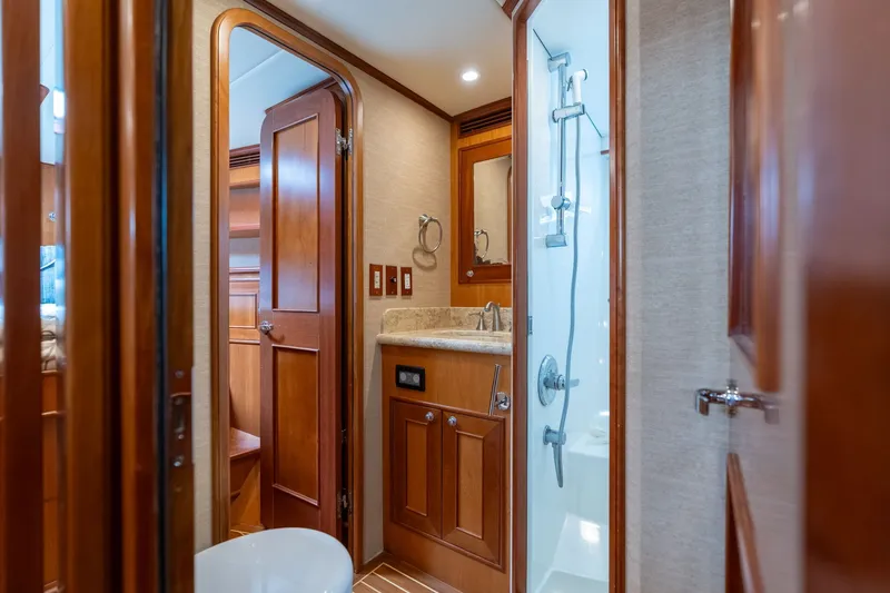 Slide: The Image of Luxurious 2009 Outer Reef Yachts motor yacht bathroom with wood accents and modern fixtures. - 23