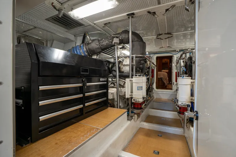 Slide: The Image of Engine room of a 2009 Outer Reef Yachts Motor Yacht, featuring tools and machinery. - 63