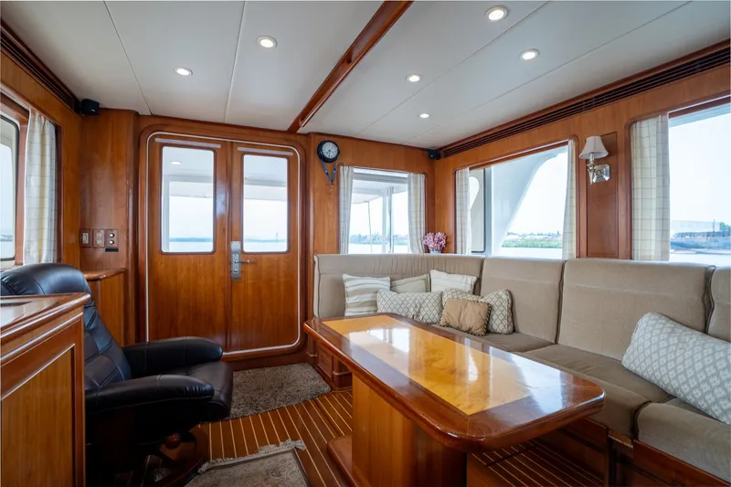 Slide: The Image of Luxurious 2009 Outer Reef Yachts motor yacht interior with elegant wood finishes and comfortable seating. - 6