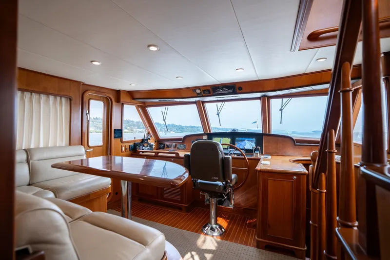 Slide: The Image of Luxurious 2009 Outer Reef Yachts motor yacht interior with helm, seating, and panoramic windows. - 11