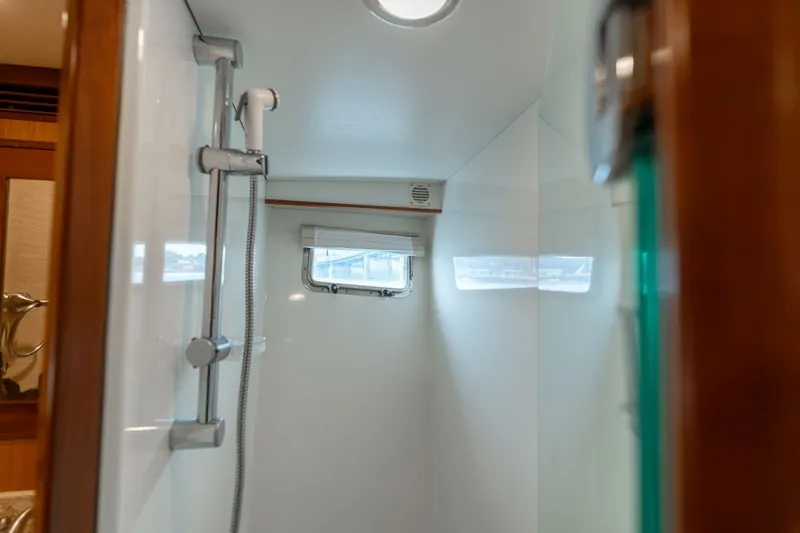 Slide: The Image of Shower area inside a 2009 Outer Reef Yachts motor yacht, featuring a sleek design. - 24