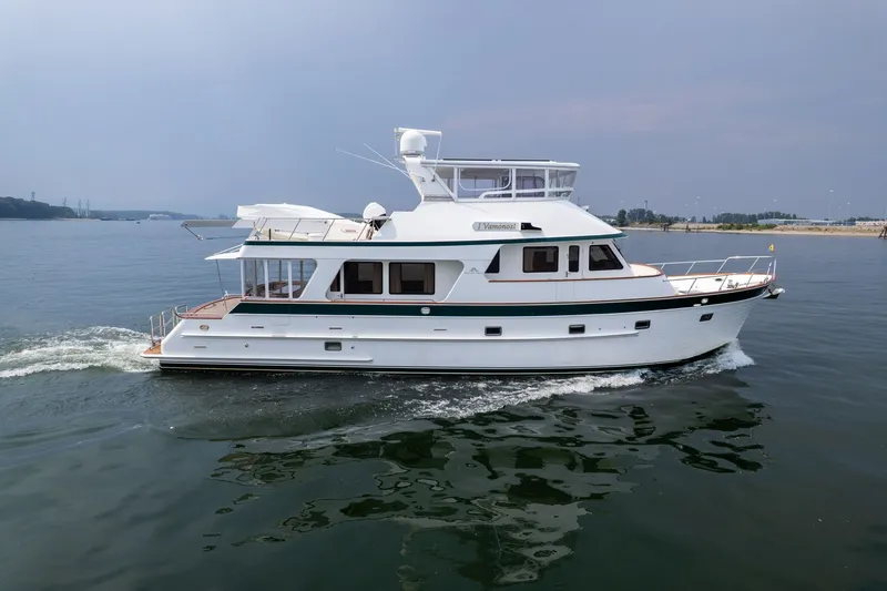 Slide: The Image of 2009 Outer Reef Yachts Motor Yacht cruising on calm waters. - 68