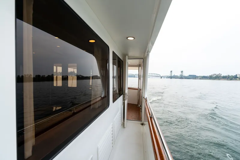 Slide: The Image of Side view of 2009 Outer Reef Yachts Motor Yacht cruising on calm waters. - 42