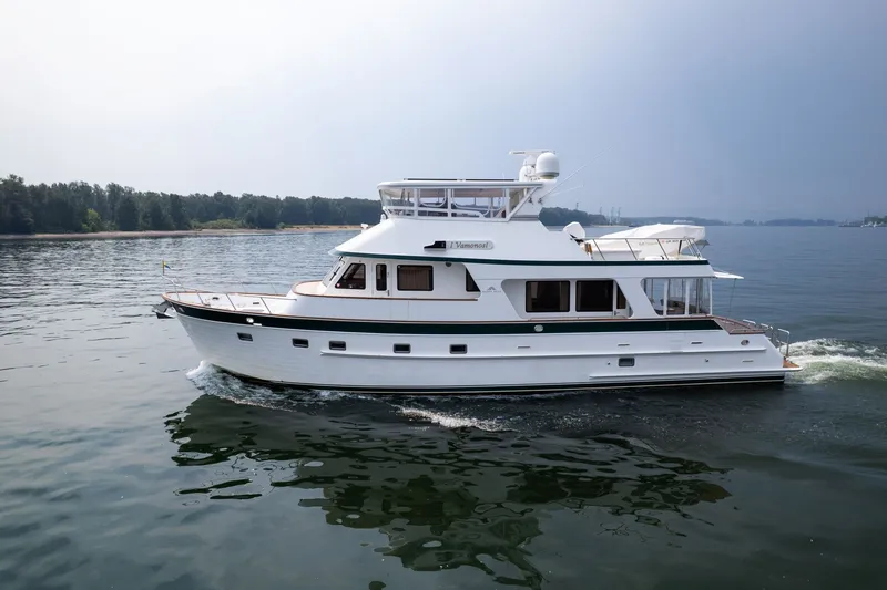 Slide: The Image of 2009 Outer Reef Yachts Motor Yacht cruising on calm waters. - 53